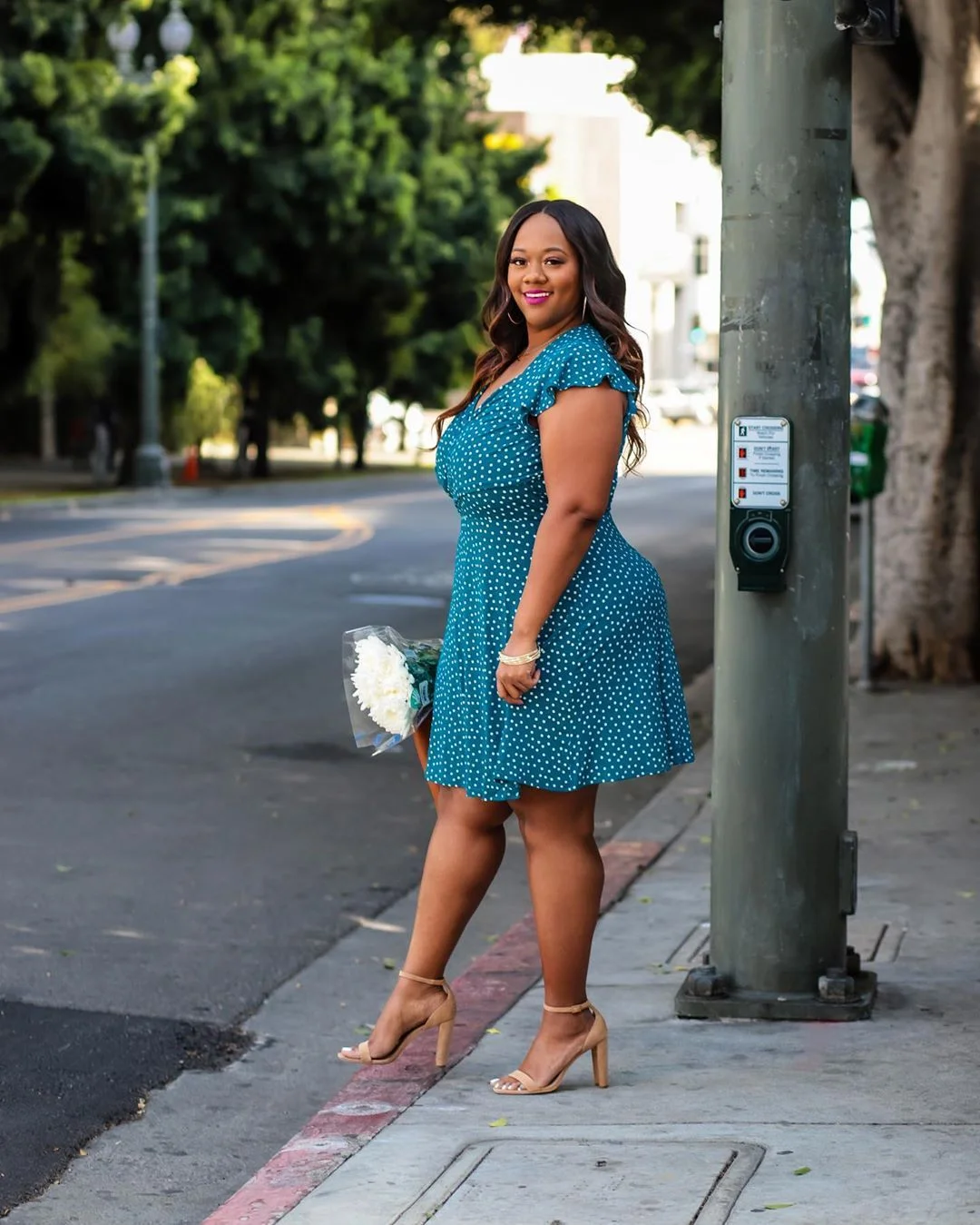 Teal skater dress on a plus-size woman