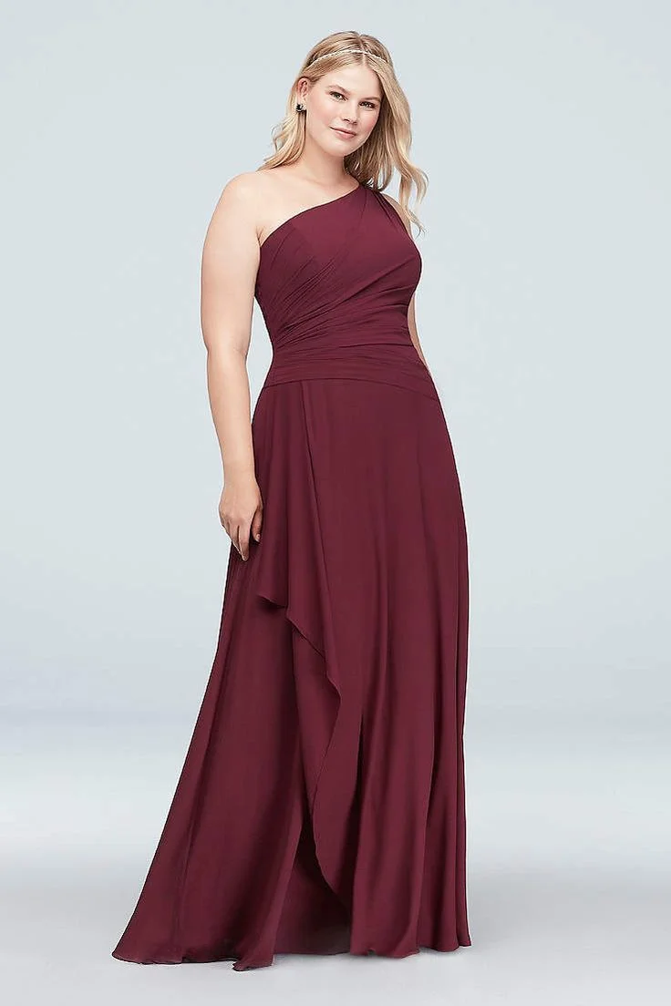 Burgundy one-shoulder gown on a plus-size woman