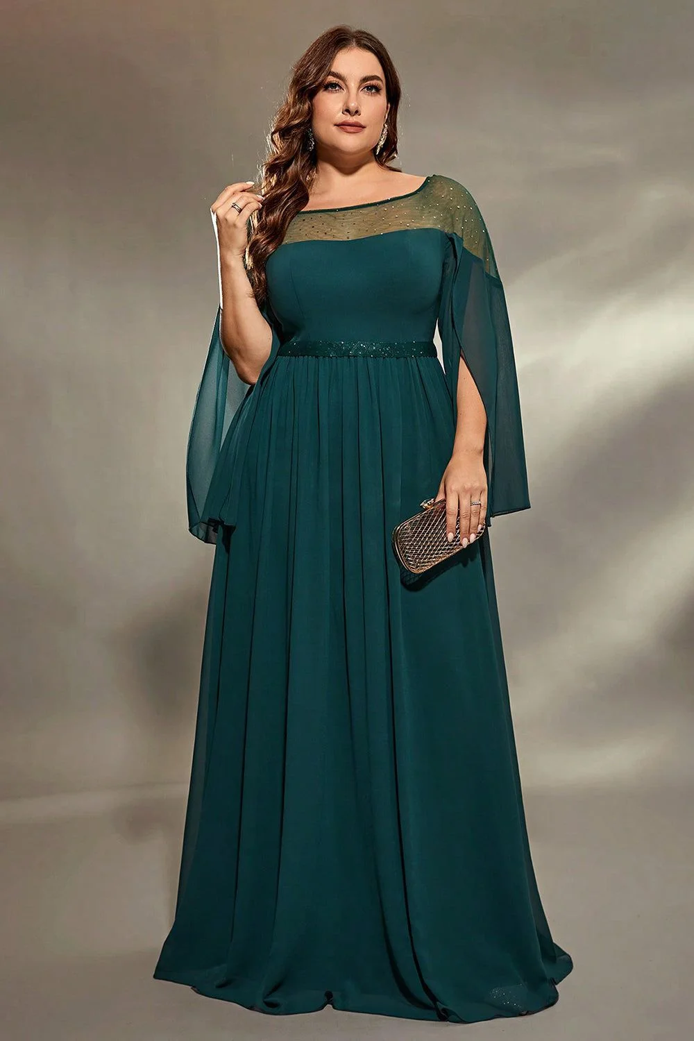 Teal cape sleeve formal gown on a plus-size woman