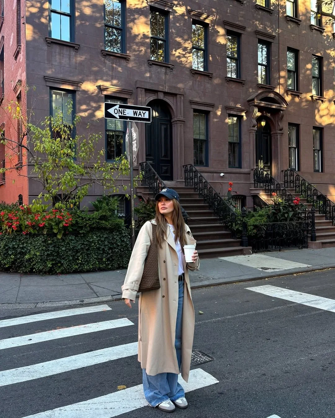 NYC fall outfit: long cream coat street style crosswalk look
