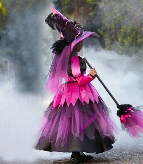 Pink hair halloween costume: pink witch with broom back view