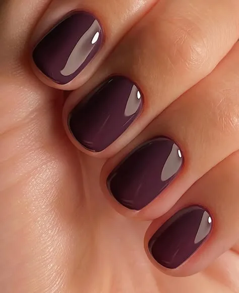 Plum fall nails: glossy plum squoval nails close-up