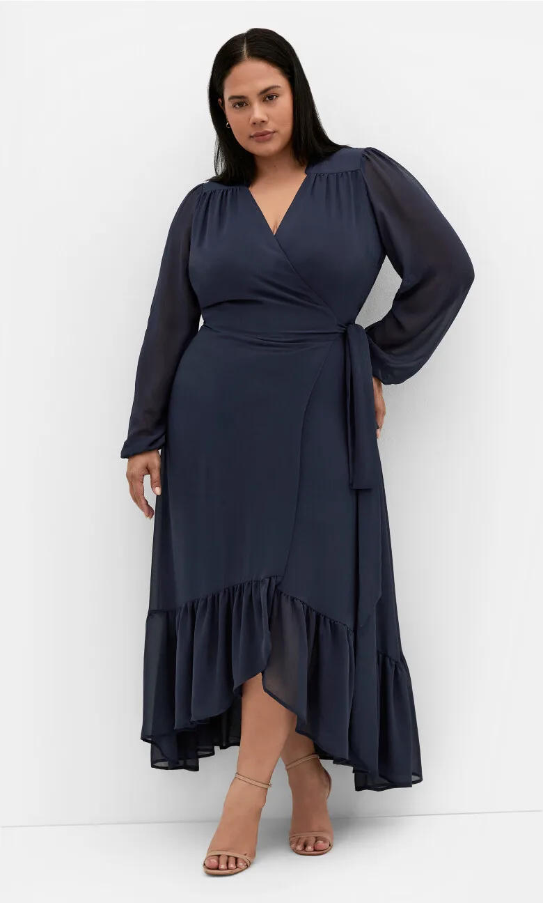 Navy blue wrap midi dress on a curvy woman