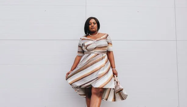 Striped off-the-shoulder midi dress, plus size Black woman outdoors