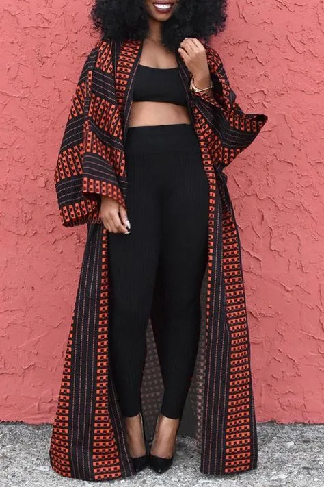 Plus size mom outfit: black top and leggings with a red patterned kimono
