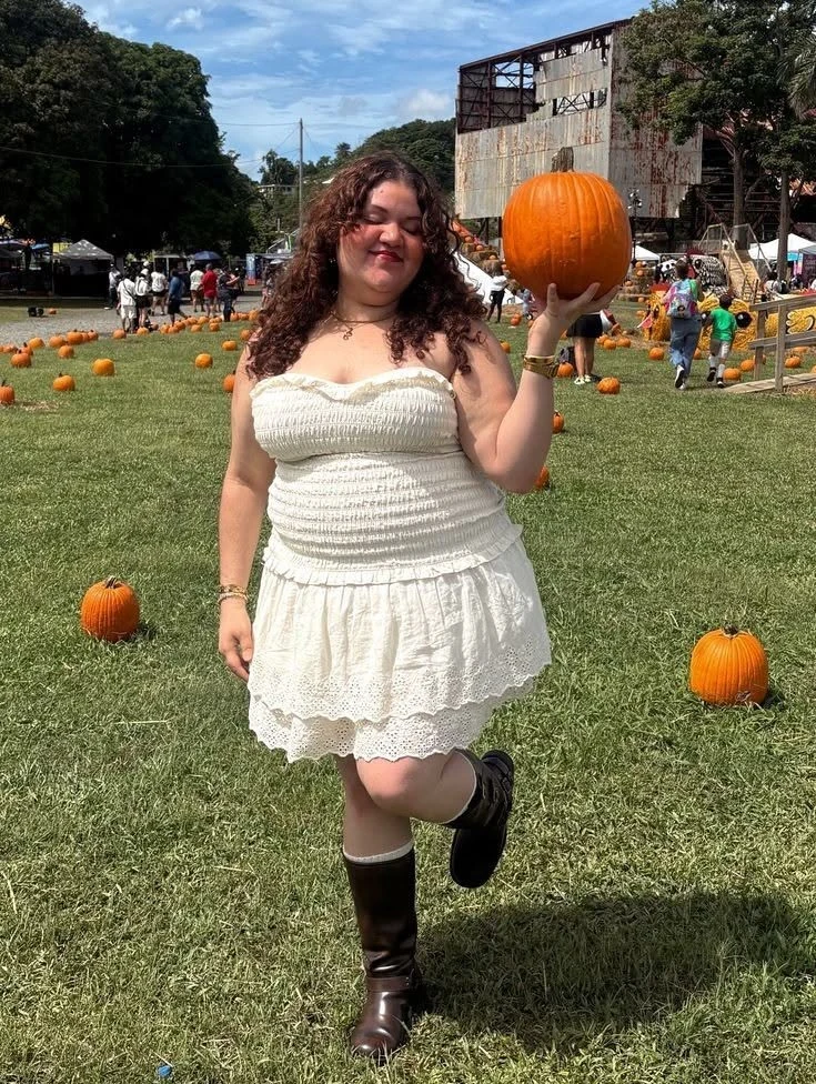Plus size pumpkin patch outfit: white smocked dress with tall brown boots