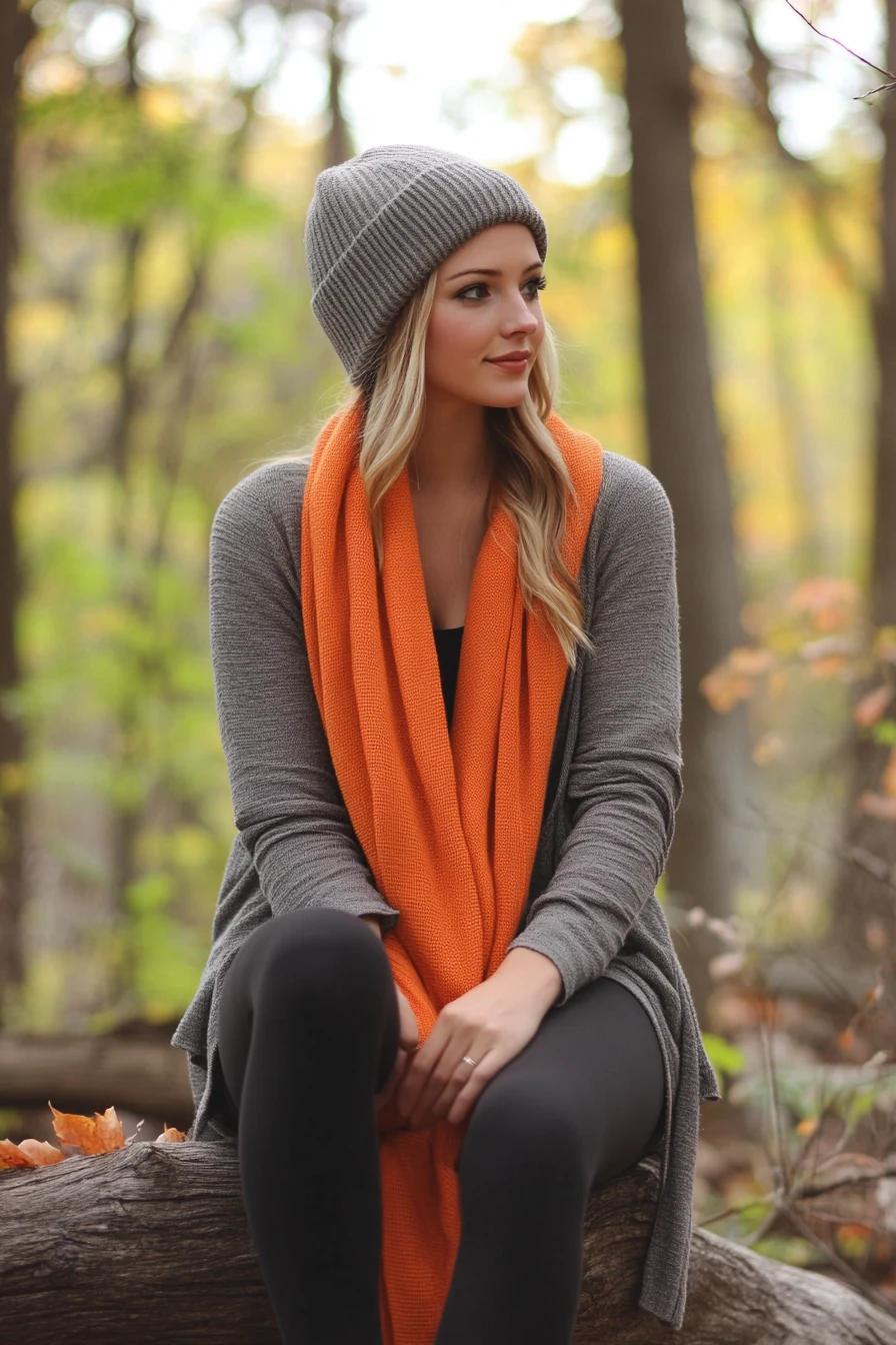 Fall pumpkin patch outfit: grey beanie, orange scarf and grey cardigan layers