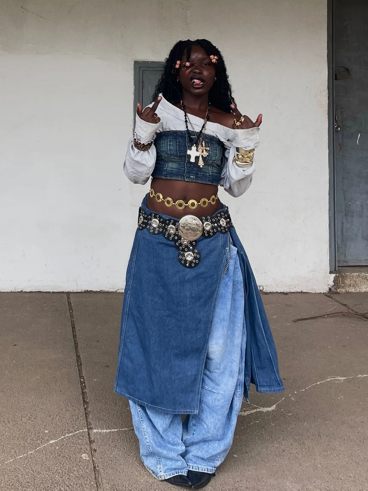 Steve Lacy concert outfit: denim maxi skirt with concho belt and boots
