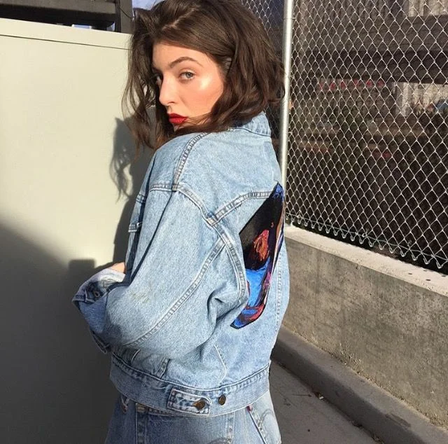 Steve Lacy concert outfit: denim jacket styled from the back