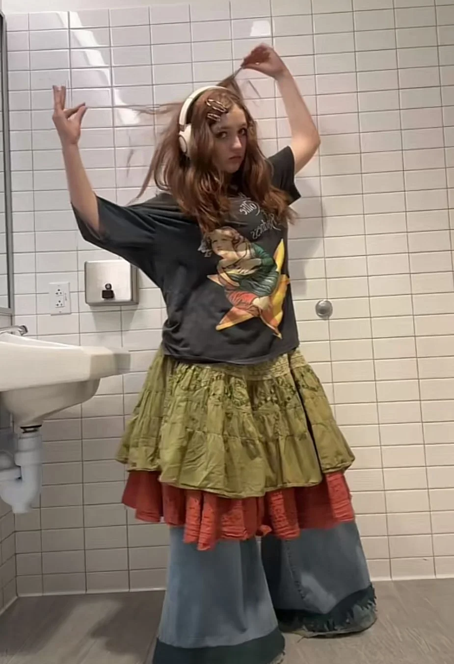 Steve Lacy concert outfit: oversized band tee with tiered ruffle skirt