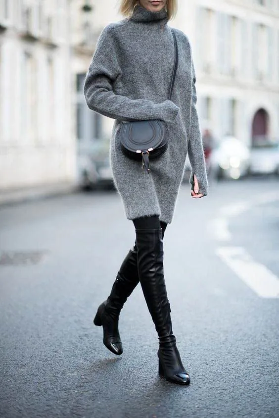Grey turtleneck sweater dress with black over the knee boots and black bag