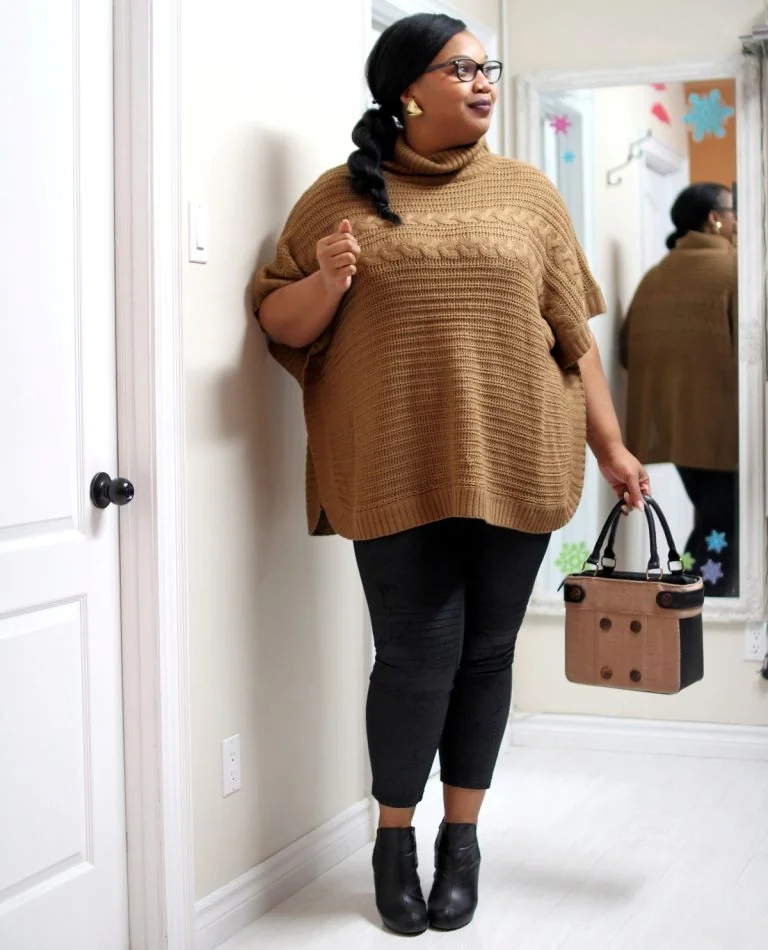 Cozy thanksgiving outfit: camel poncho sweater with black leggings and booties