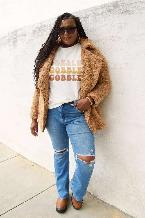 Casual thanksgiving outfit: gobble graphic tee with teddy coat and jeans