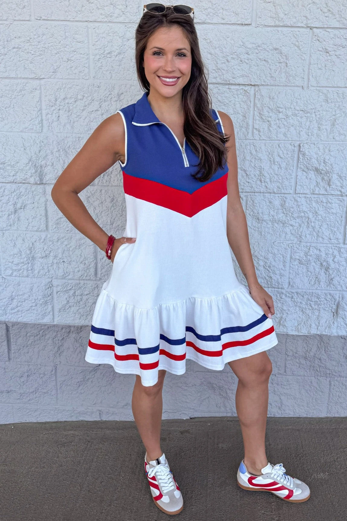 Plus size woman in red white and blue chevron polo dress with sneakers