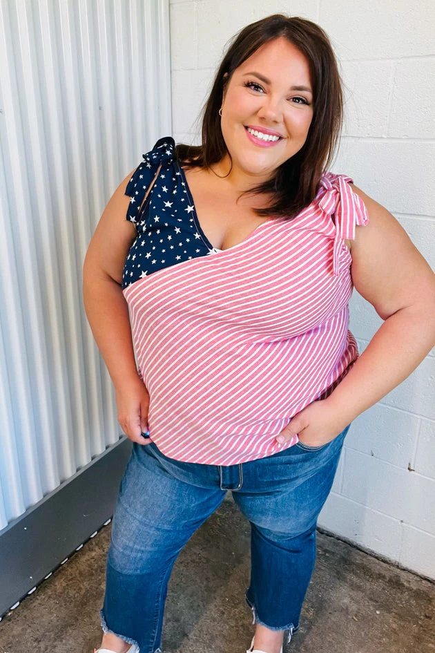 Plus size woman in stars and stripes tie-shoulder top and jeans