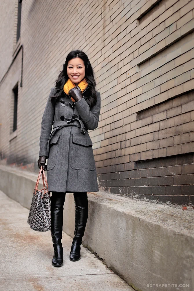 Grey wrap winter coat with yellow scarf and boots