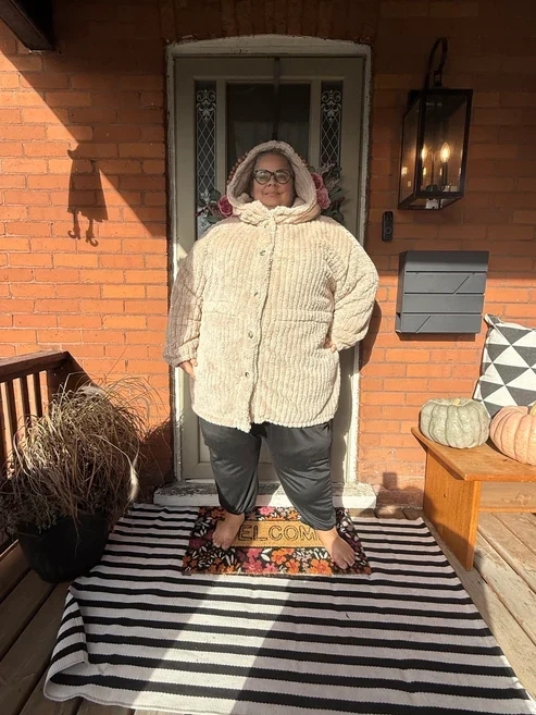 Cream quilted winter jacket casual outfit by the door