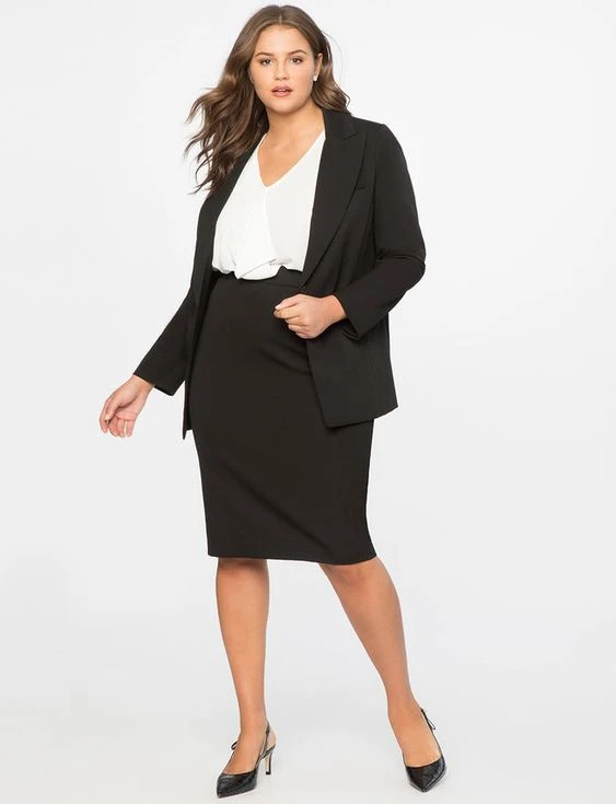 Veterans Day business casual outfit: black blazer with white top and black pencil skirt on curvy woman