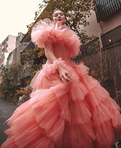 Whimsical outfit idea: coral tiered tulle gown with ruffled shoulder detail