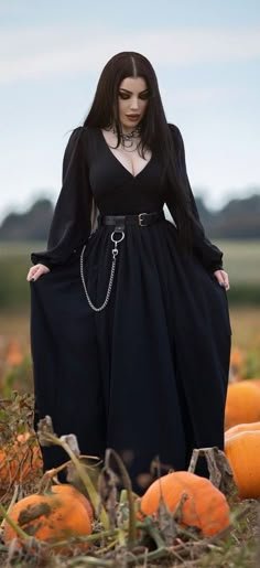Plus size witchy fall outfit: black gown with pumpkins